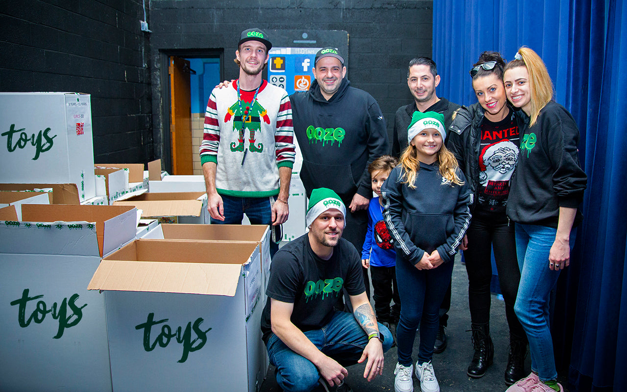 An overhead shot from the gymnasium balcony at Impact Church in Detroit. People are gathering for the Oozemas Christmas Toy Drive Event hosted by Ooze Wholesale and the Shelby Jane Seyburn Foundation.